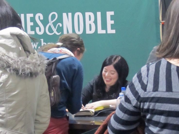 (Signing books after the Reader's Theater. Photo courtesy of my mom!)